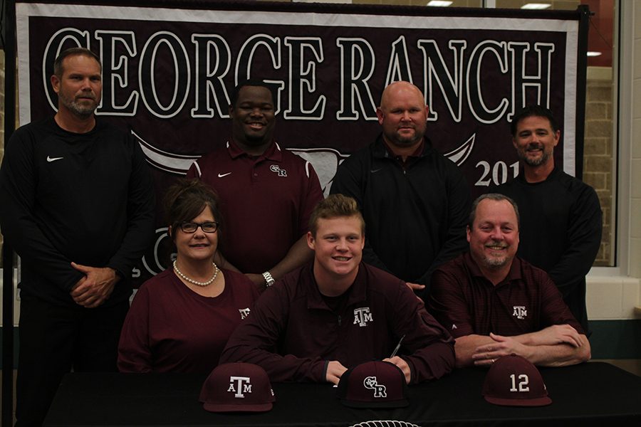 Joseph Menefee signing excitedly with his family. 