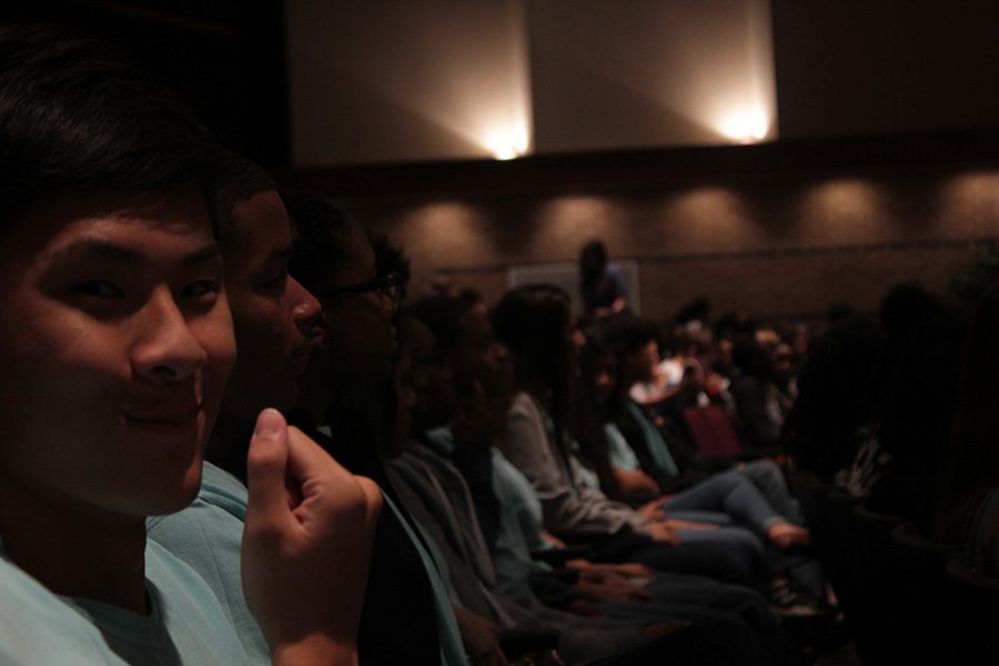 Vinson Huang catches the camera as the rest of GRHS Student Council members listen to the speaker.