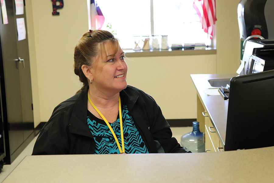 Nurse Vivian speaks to a student in her office