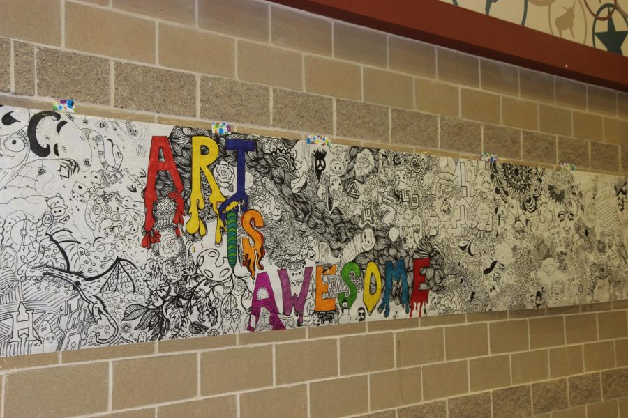 The students in Art Club worked on this Art is Awesome banner to hang in the hallway to commemorate each 
students different art style.   