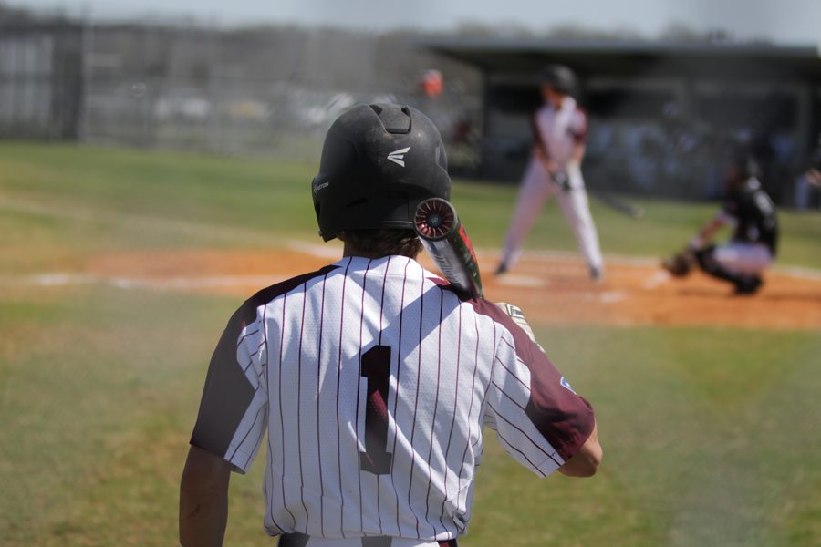 #1 (Jacob Wilson) stands on the on-deck circle before his at-bat