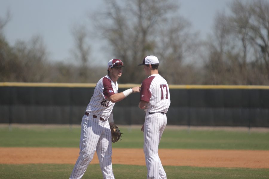 Third Baseman Ty Abraham speaks with Pitcher Jacob Surratt between batters