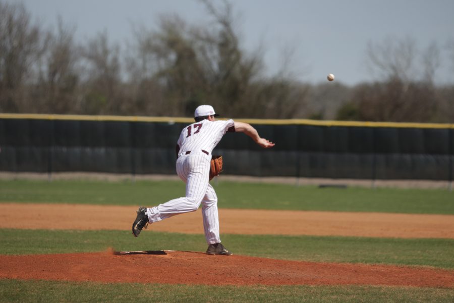 Pitcher Jacob Surratt throws a pick off to first