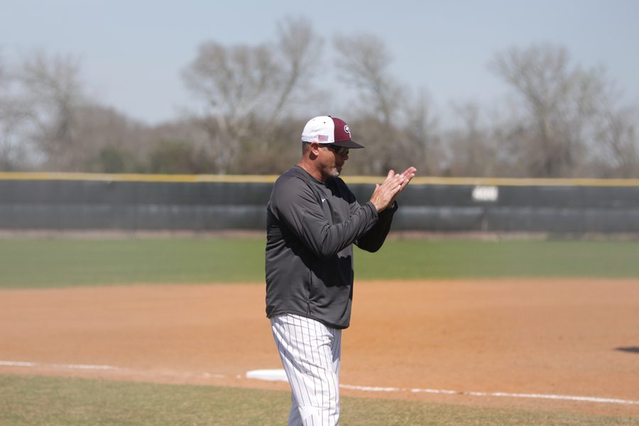 Coach Kobza claps as more runners score