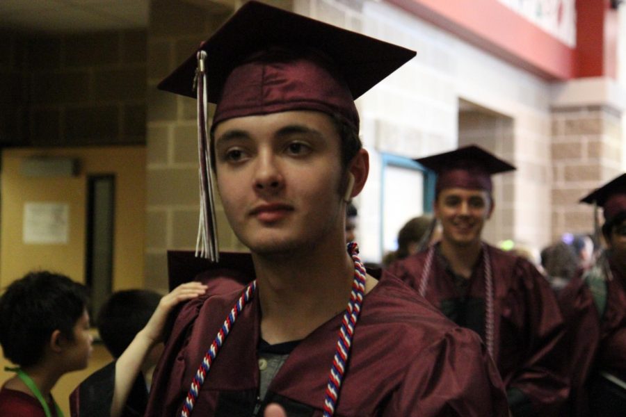 Noah Smith wears his military cord, indicating that he has enlisted into the Armed Forces. 