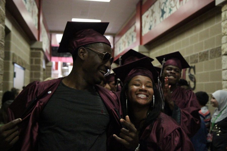 Chris Johnson flexes for the camera as he walks the halls to success. 