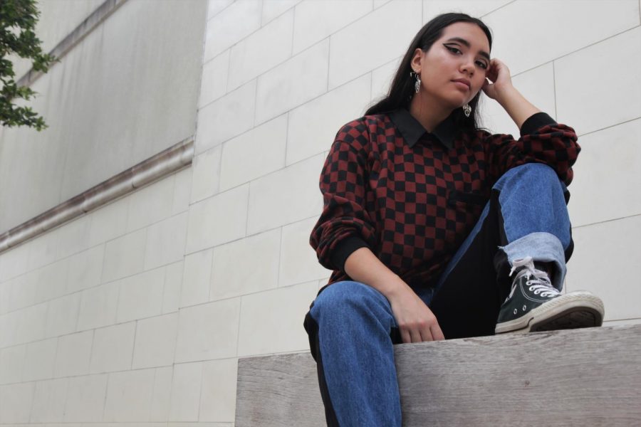 Marleen Ngyuen (11th)  is flaunting a maroon oversized sweat shirt. She paired her sweat shirt with a pair of denim pants which has a statement pattern. The block pattern on her shirt is very in trend right now for the season of 2018 fall fashion.