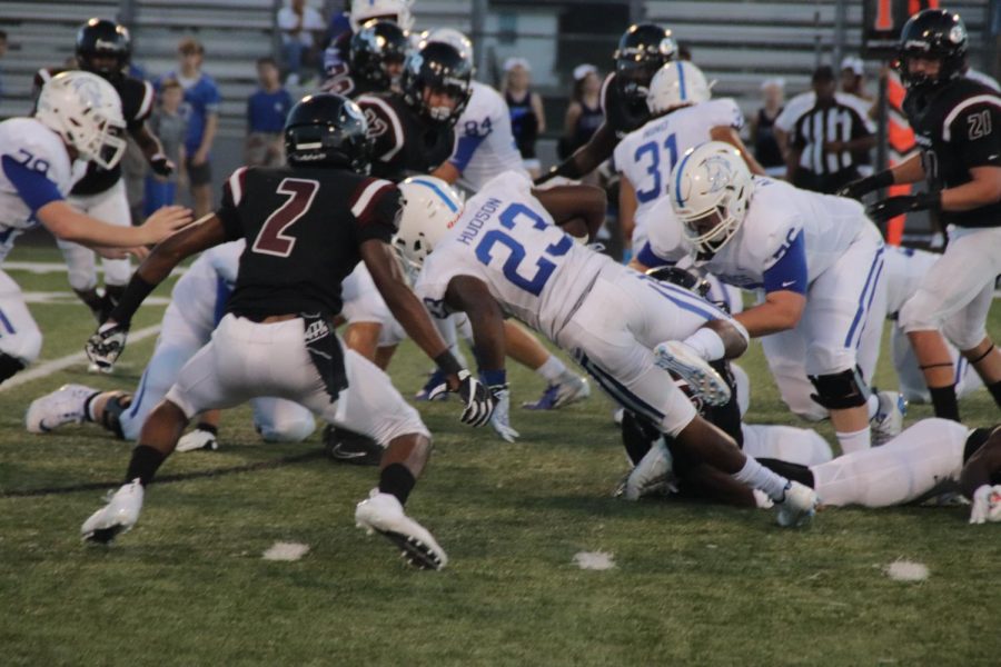 Sean Lebari(12) sees the runningback falling so he jumps on him to get the tackle.