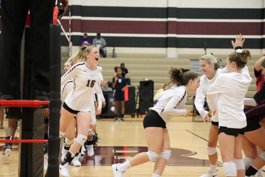 Avery Shimaits (9) is showing overwhelming  eagerness to begin the game as the team becomes pumped up.