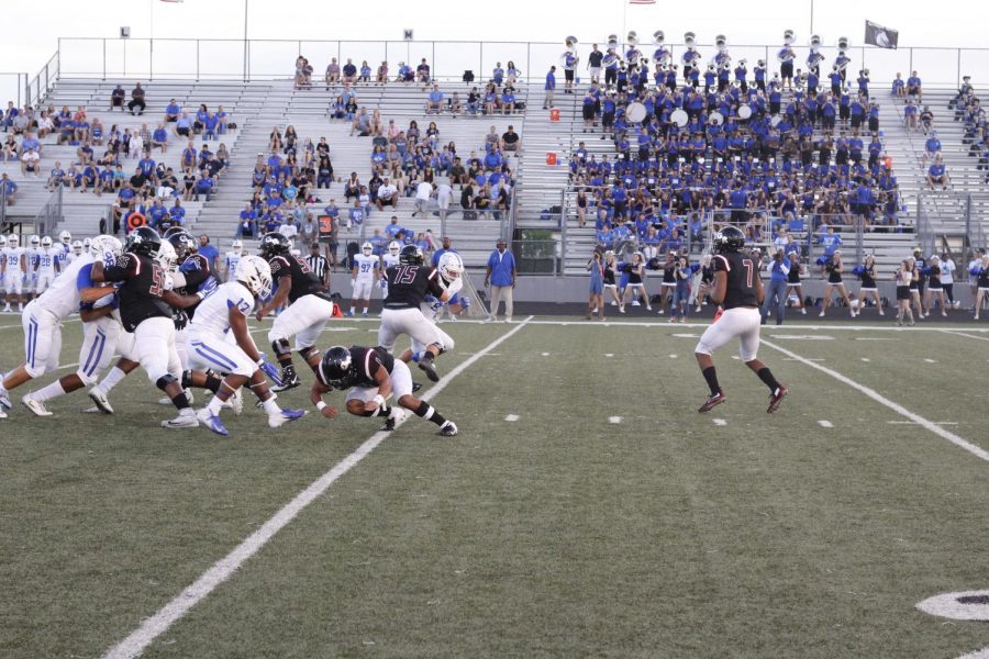 Christian Jackson (12th grade) looking for the open man to throw the ball.