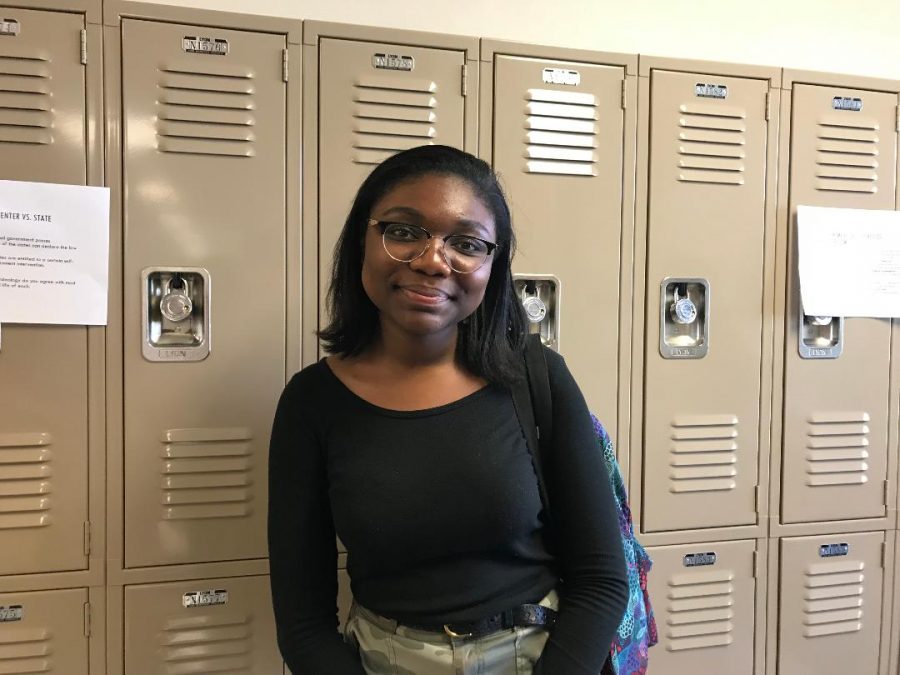 Cydney Parks stands against the lockers before class