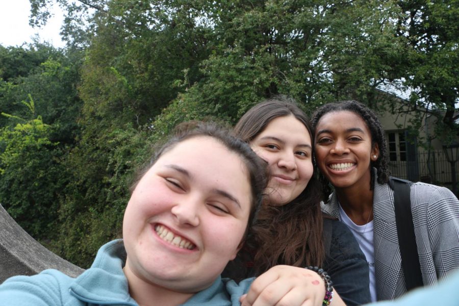 Bailey Holton, Daniela Hernandez, and Aamaya Khan in the Riverwalk snap a quick picture for their scavenger hunt photo contest.