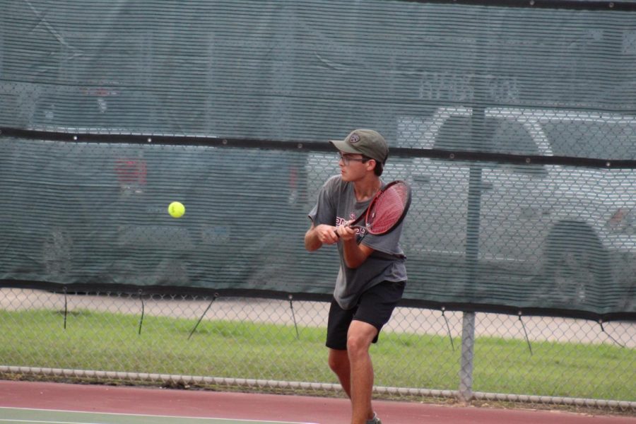 Nicolas Heard (12) hits the ball to his opponent.