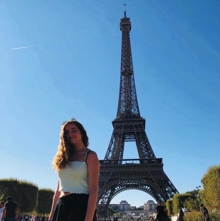 Guehria in front of the Eiffel Tower during her trip this past summer.