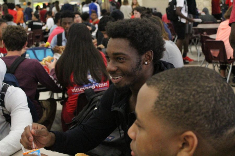 Deandre Murphy (11) listens to his friends at lunch.