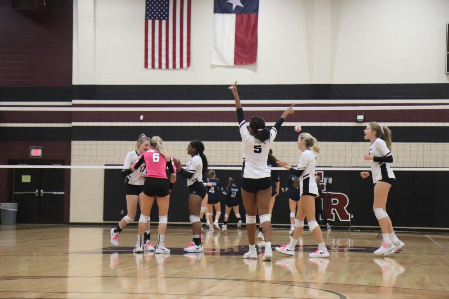 Audrey Tuttle (12), Gabriella Ayiteyfio (10), Kennedy Prince (12), Madysen Rathmell (12), and Alexandra Sczech (9) celebrating after Avery Shimaitis (9) got a great kill.