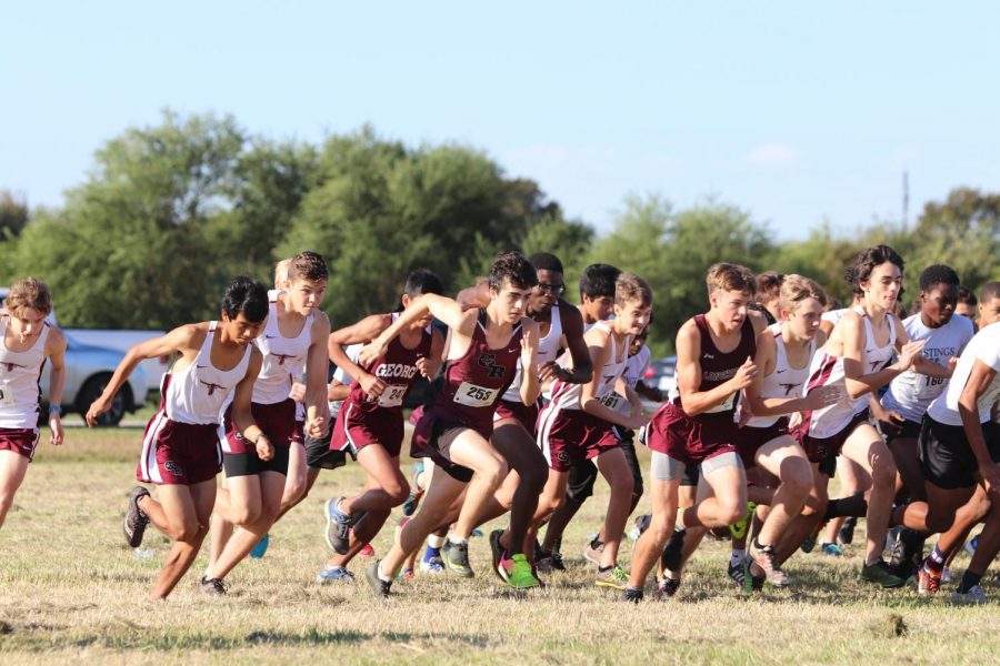 The JV boys team beginning their race.