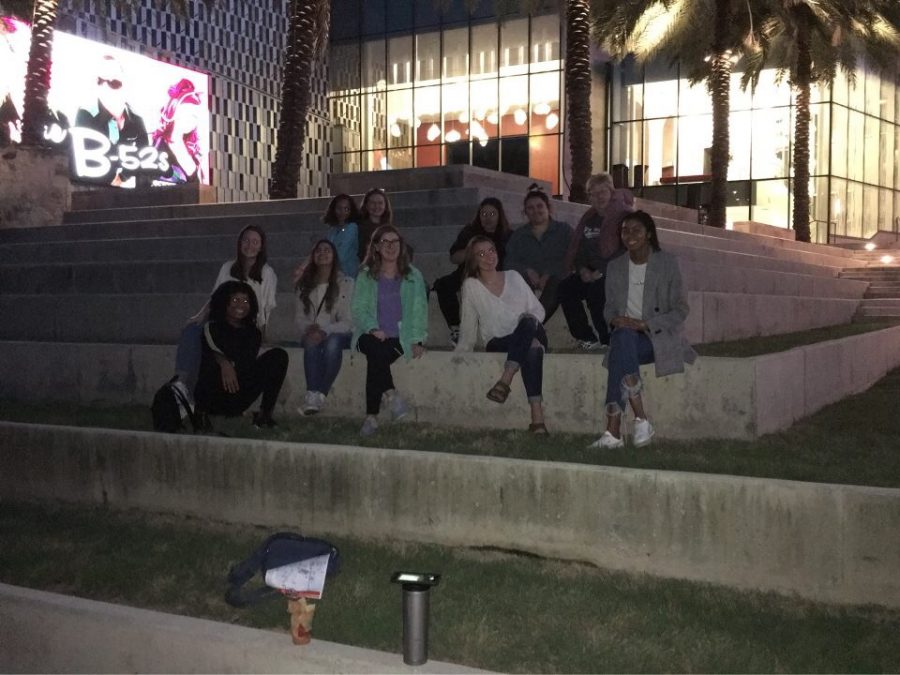 The editors and Mrs. Kroeker in front of a museum. 