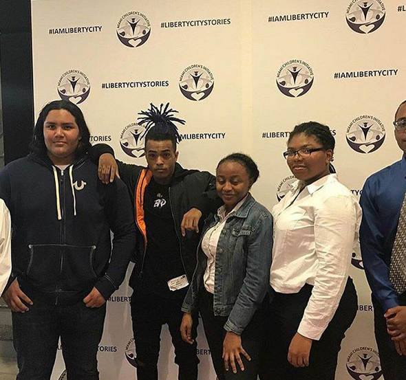 XXXTentacion (pictured middle left) partnering with the Miami Childrens Initiative on March 16th, 2018.