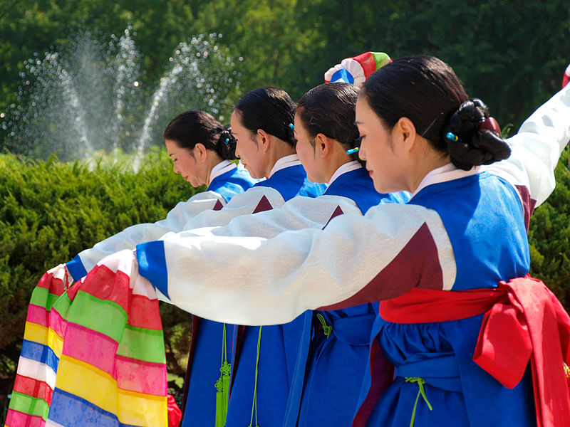 Dancers stand poised and ready as they perform a traditional Korean sword dance. 