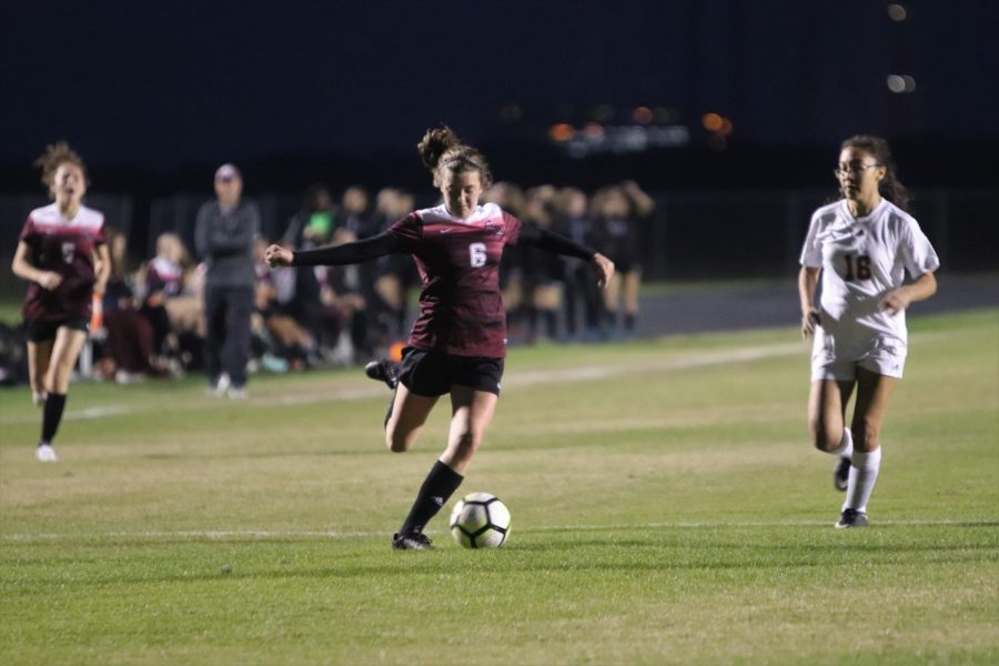 Reagan Grafe (9) about to pass the ball.