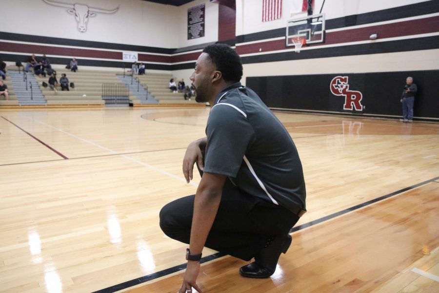 Coach Jones yelling out plays to his longhorn players.