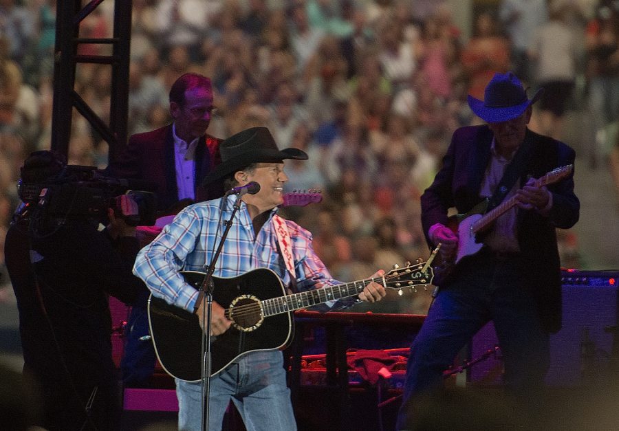 George Strait performing on stage.