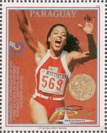A stamp of Florence Griffith celebrating after winning the 100m final.