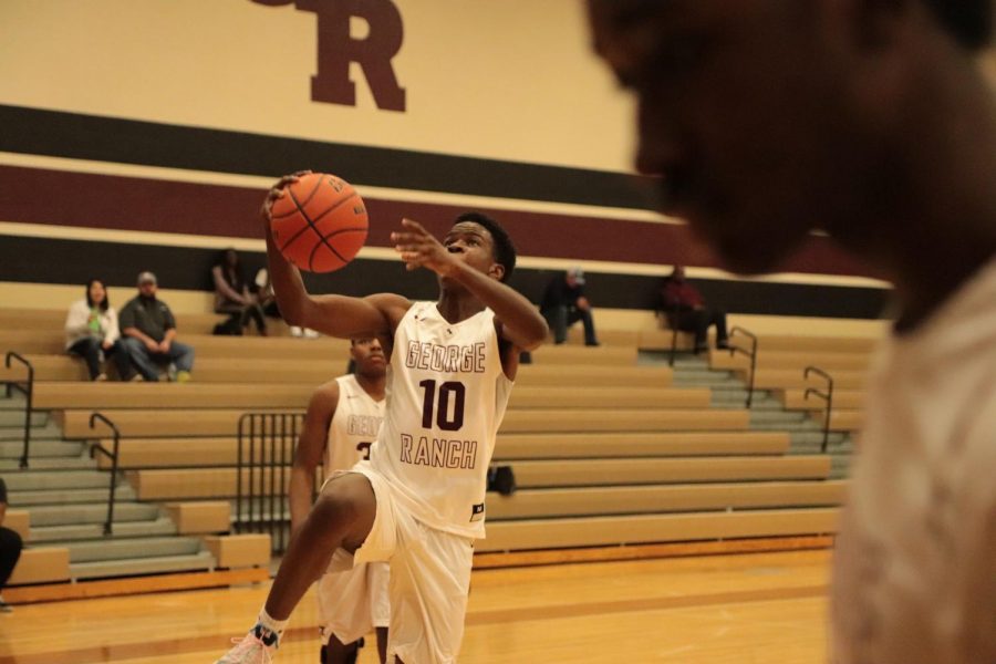 Chübby Uchenna (10) making a layup towards the goal