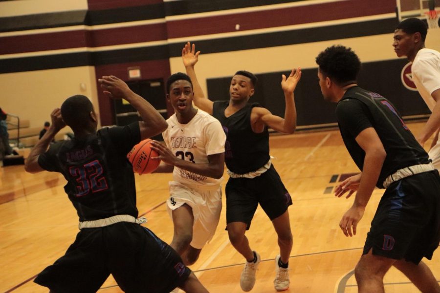 Eseosa Irowa (10) Dogding the defenders and aiming for a layup 