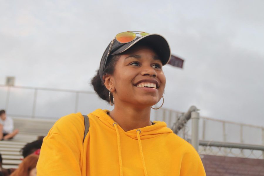 Katalyena Wells (12) Smiling with glee as she is waiting to help set up for the homecoming game.