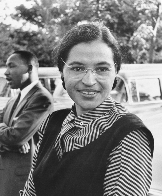 Rosa Parks with Martin Luther King Jr. in the background.