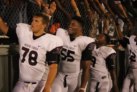 Kingsley Keke (pictured middle) after an away game in 2014.