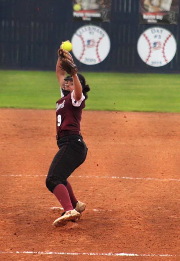 Natalie Zamora (10) using all her power to try to out pitch her opponents batter. 