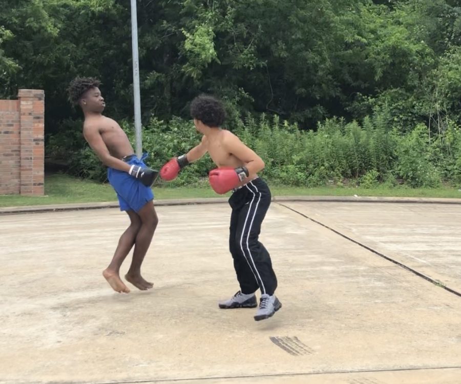 Outside of my house boxing my friend, Rhaman Anifowoshe.