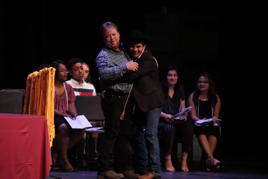 Raul Zepada (12) giving one last hug to his Agriculture teacher, Mr. Brown.