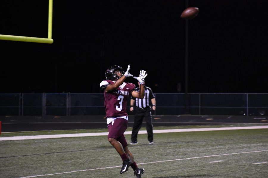 Andre Falkquay (12) completing a pass to make a touchdown.