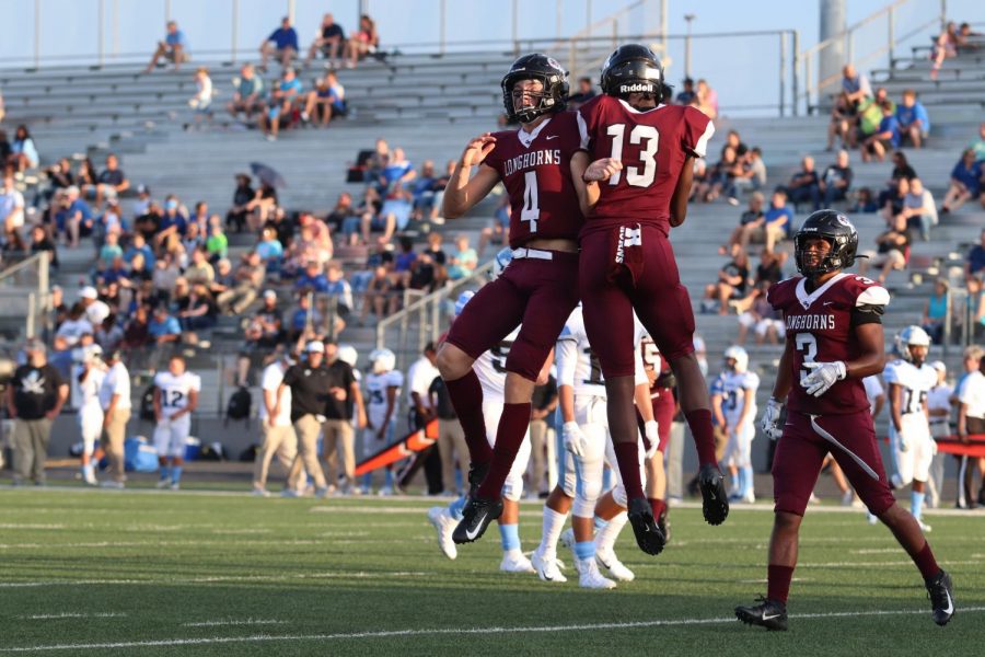 No. 4 Sam Miller (11) and No. 13 Javon Gipson (11) celebrating Gipsons first touch down for the night. This is Millers and Gipsons junior year, so they are giving it their all on the field to keep our Longhorn legacy of winning.