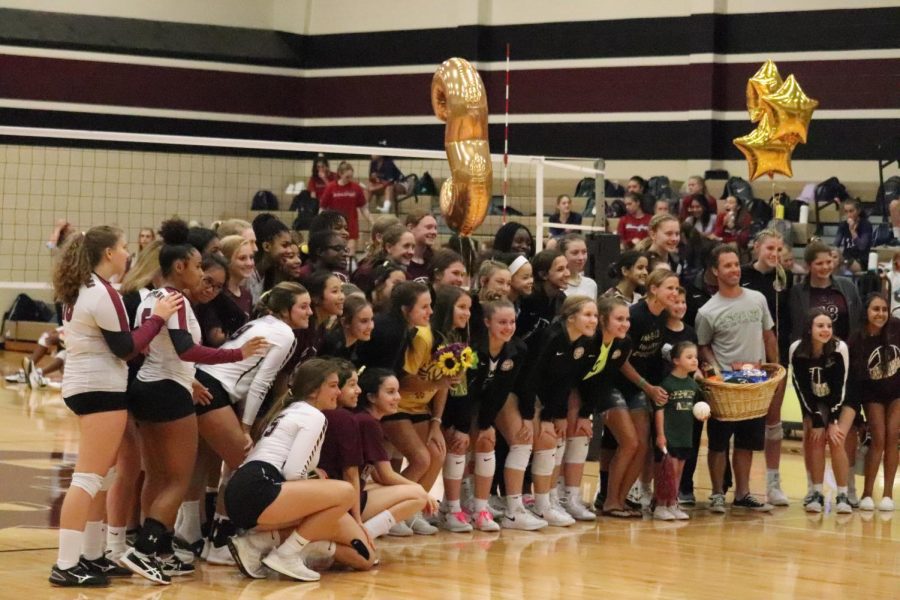 the volleyball teams come together to show support for child cancer