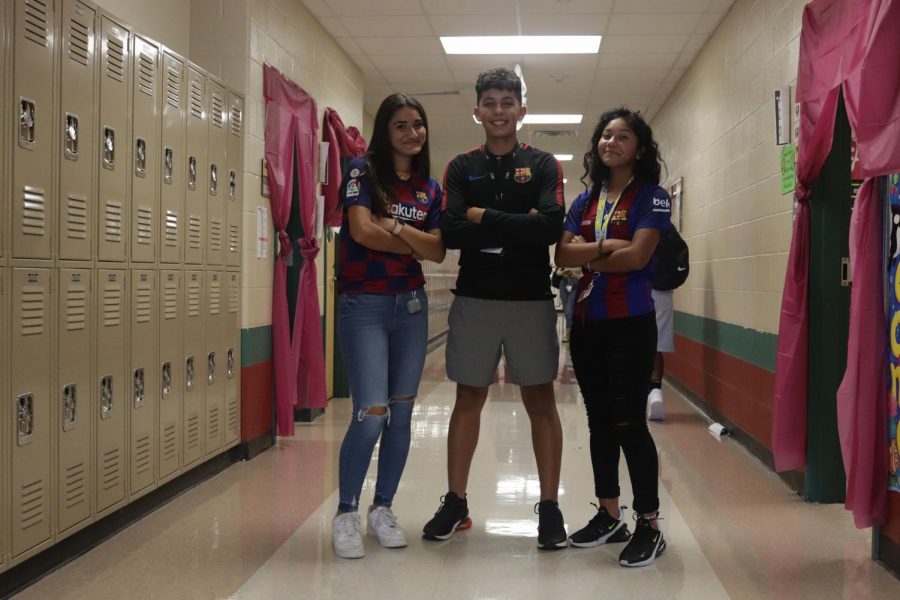 As they show their favorite team Barcelona 
Daniella Mendez -Right