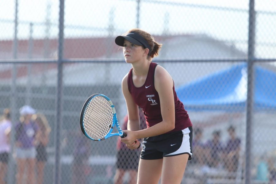 Elaina Ingelmo (9) keeps her eye on her opponent, waiting for he rnext move. This is Ingelmos first year on the tennis team!