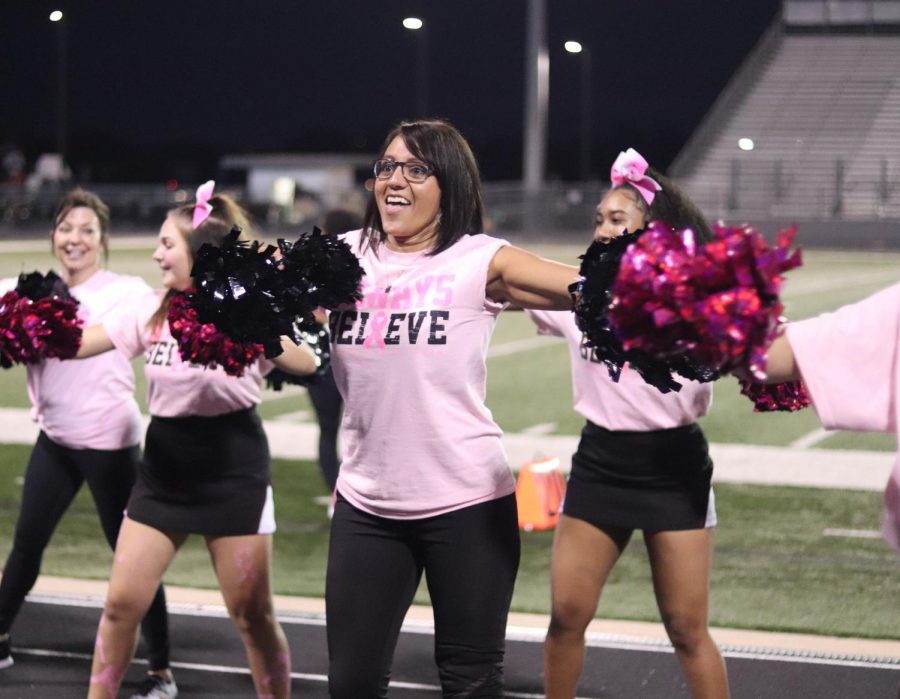 ARJH Coach Walker pursuing her inner cheer abilities along side her daughter, Devin Walker (12).