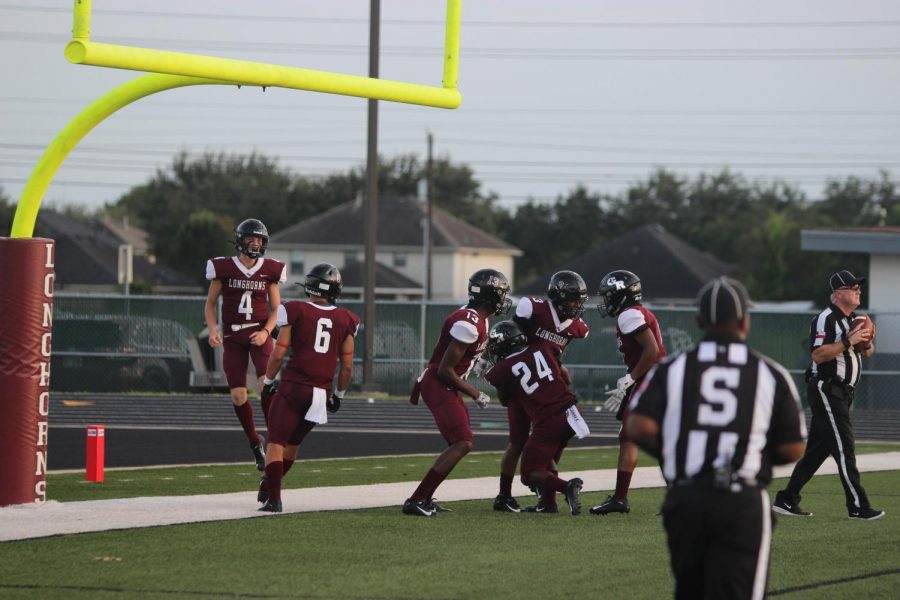 sam miller (12) brett jetton (12) jumping for joy as scoring another touchdown 