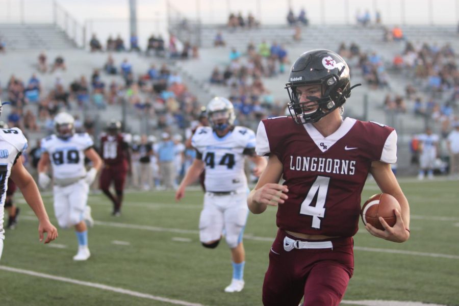 Sam Miller (12) running towards the end zone to make another score on brazoswood 