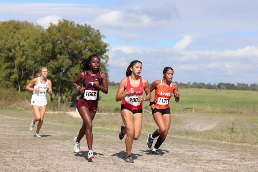 Kianna Stamps (9), speeds up to pass the girls ahead of her as she closes in on her final lap.