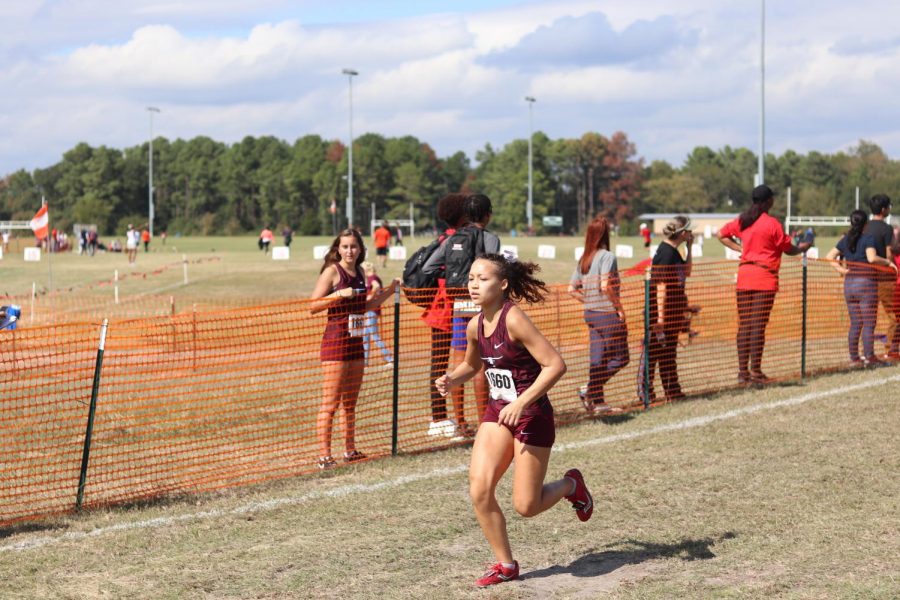 Chantell Maina (12), fights to end as the anchor, closing the team in on their 8th place win.