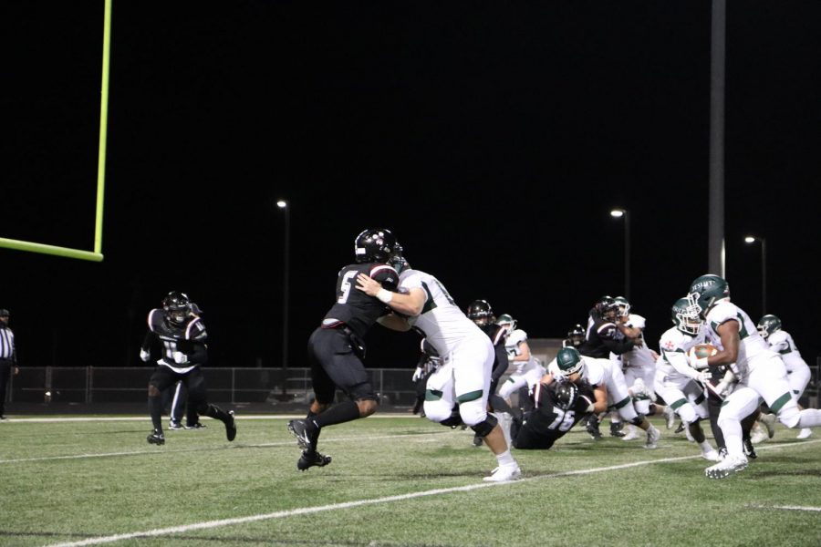 No. 5, Faybian Marks (12) blocks Strake's offense trying to prevent them from scoring.