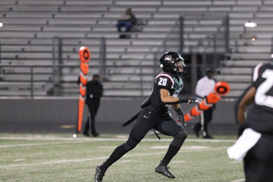 No. 20, Hymond Drinkard(10), runs down the field in attempt to catch the ball.