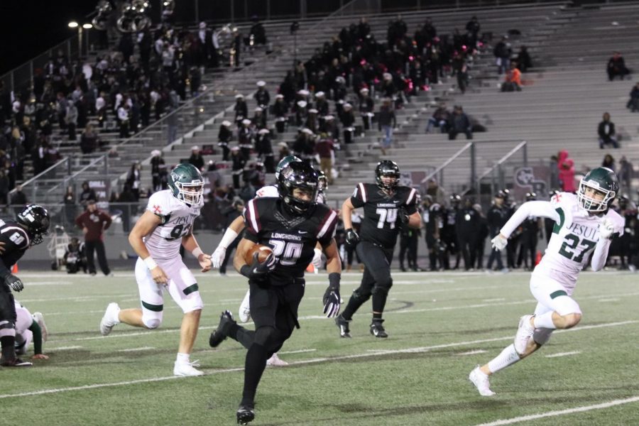 No. 20, Hymond Drinkard(10), sprints down the field, making the first touch down of the night.