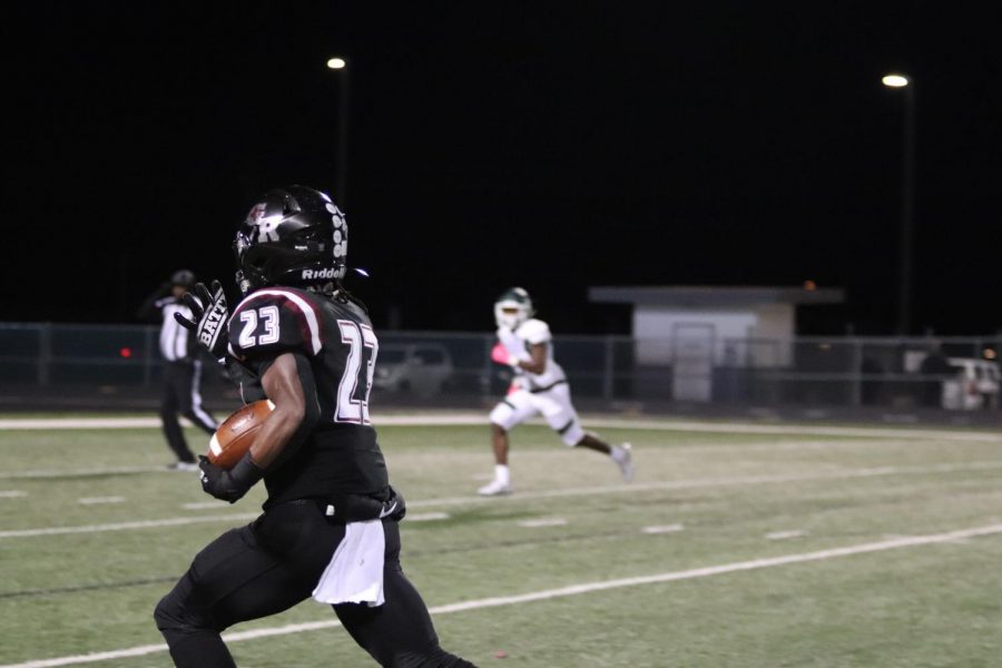 No. 23, Davion Jenkins(11), runs down the field to score the next touch down.